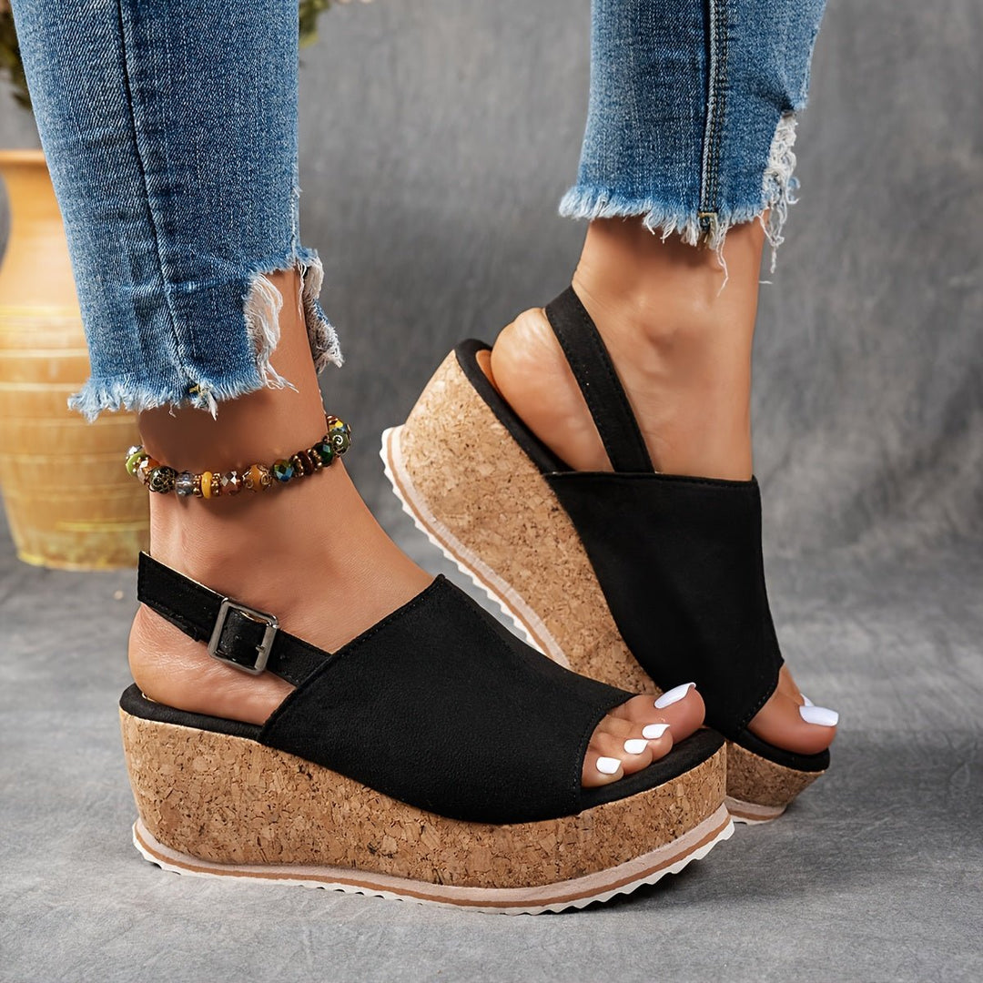 Chic women's leopard print peep toe platform wedge sandals with an ankle buckle strap, ideal for fashion-forward looks.