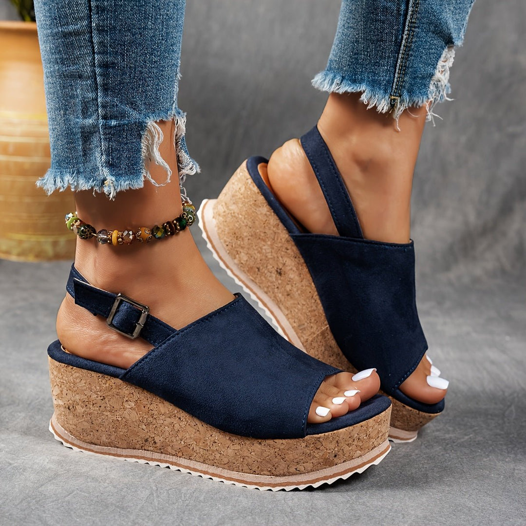 Versatile women's leopard print platform wedge sandals, featuring a comfortable design and adjustable fit for any casual occasion.