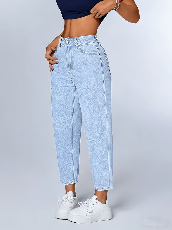 Relaxed fit light blue mom jeans for women, featuring a high waist, tapered leg, and cuffed hem.