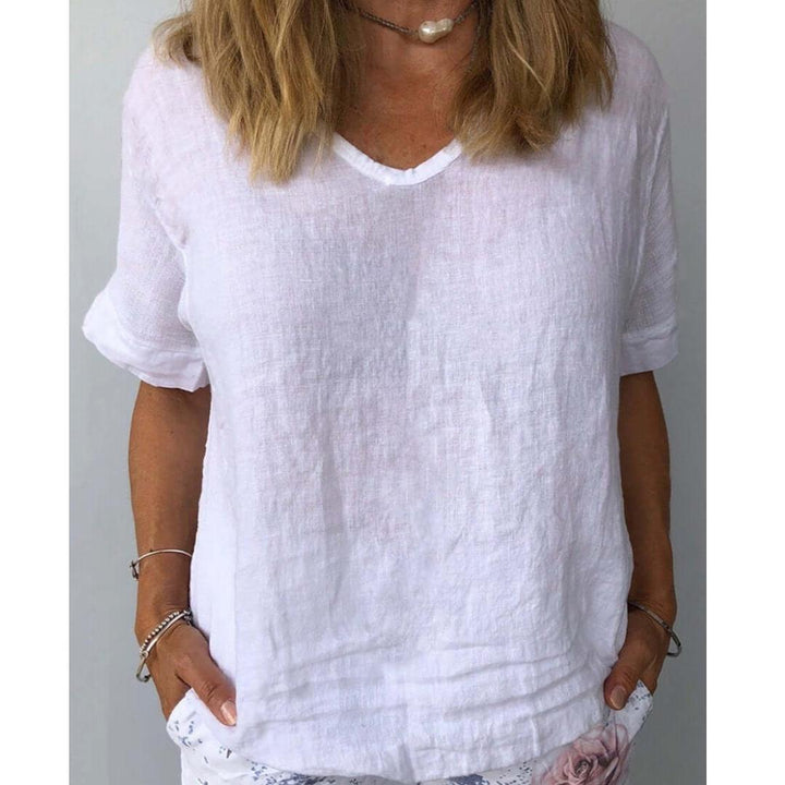 Light blue women's relaxed fit V-neck short sleeve top, perfect for casual summer style. Comfortable & versatile.