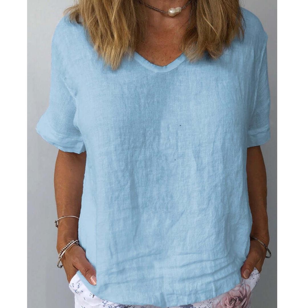 Dark blue women's relaxed fit V-neck short sleeve blouse. Stylish & comfy top, an everyday essential for summer.