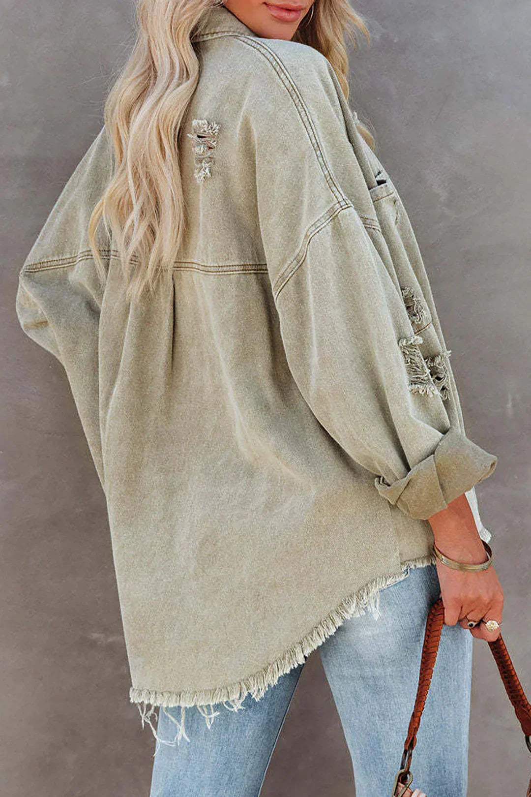 Versatile oversized light green distressed denim jacket for women, ideal casual summer fashion & everyday wear.