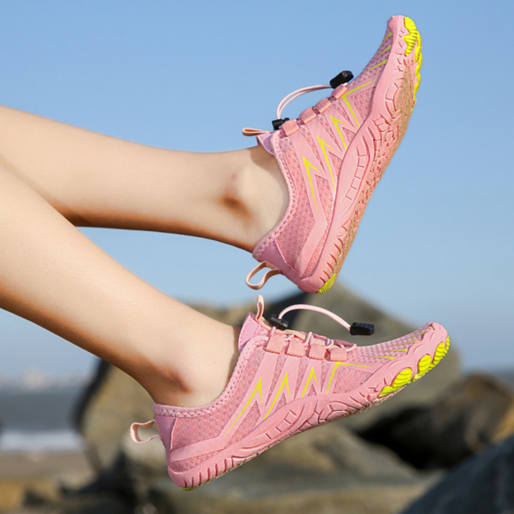 Side profile of lightweight barefoot shoes, perfect for athletic activities and natural movement.