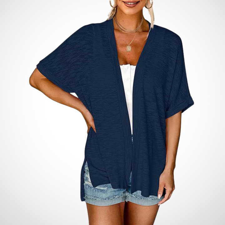 Navy blue women's short sleeve cardigan, an open front, flowing, lightweight top for casual and elegant summer style.