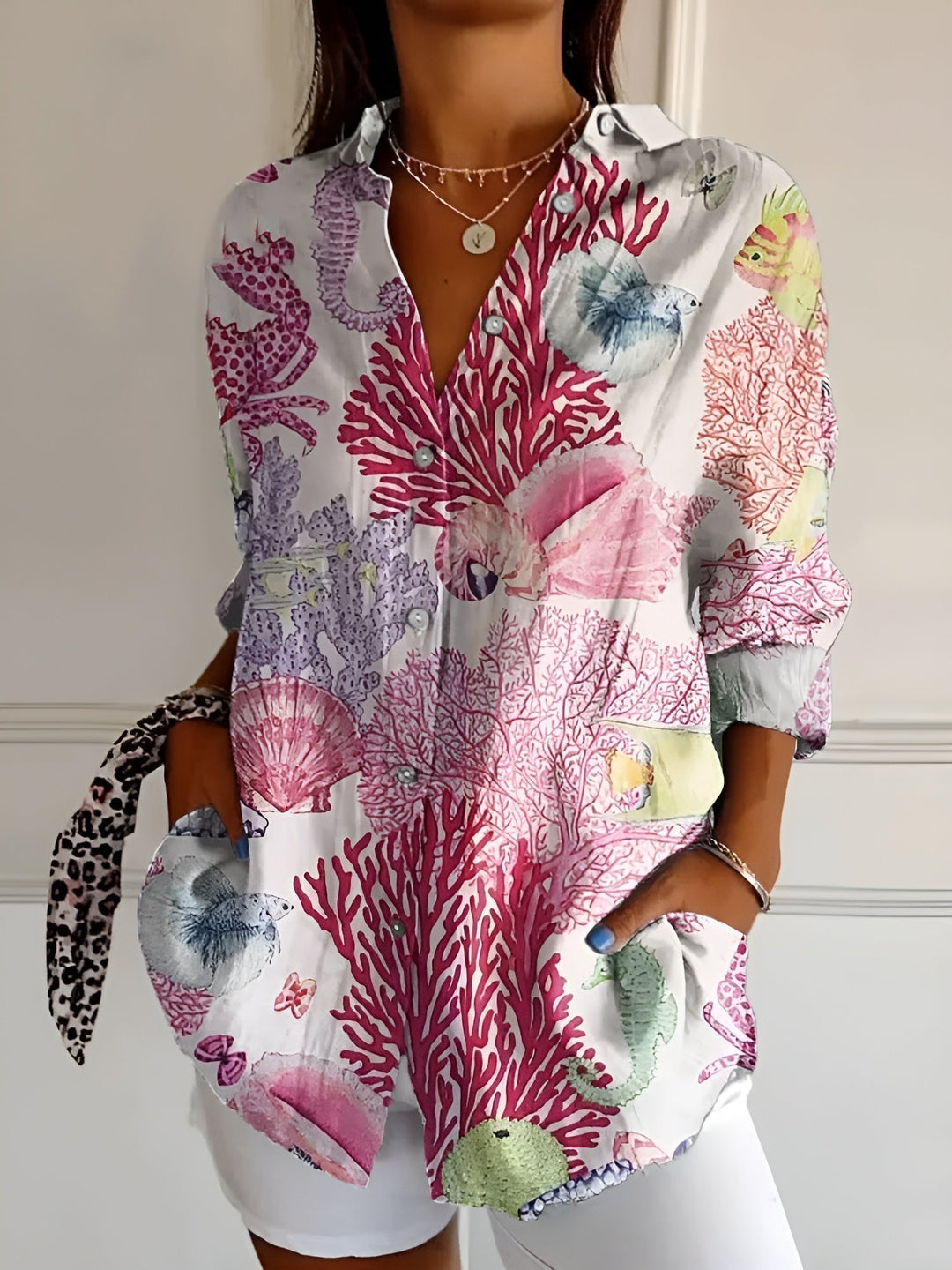 "Lightweight women's button-down summer blouse with classic collar, full-length sleeves, in breathable fabric for sunny days.