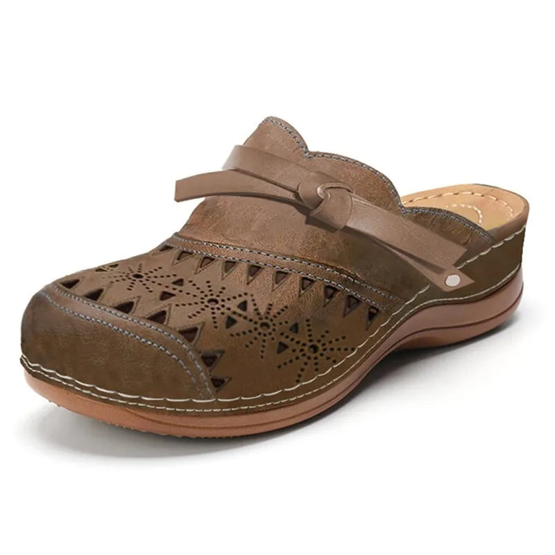 Effortless women's clogs: comfortable slip-on shoes with a stylish bow accent and unique cutout details.