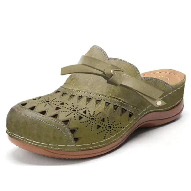 Casual women's clogs with decorative bow and cutout details. Easy slip-on backless design for comfort.
