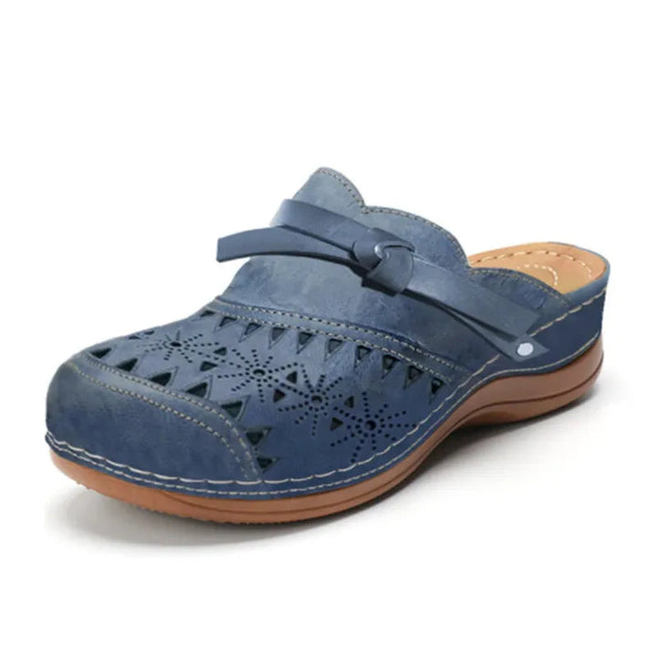 Women's slip-on clogs with elegant bow accent & stylish cutout design, perfect for casual summer wear.
