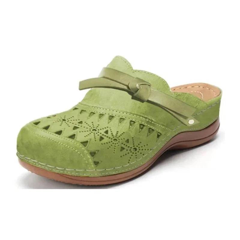 Stylish women's summer sandals: slip-on clogs with a unique cutout design & cute bow accent for easy wear.