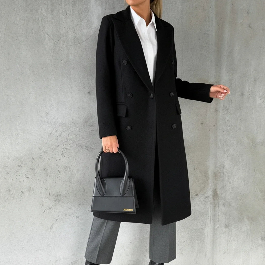 Elegant women's double-breasted long winter coat in classic style, perfect for sophisticated fall fashion.