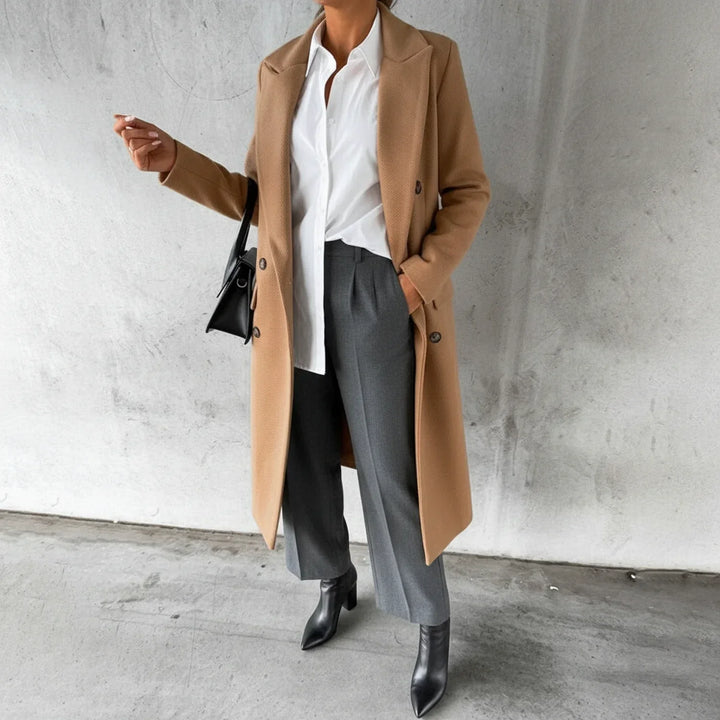 Classic women's long double-breasted coat, a sophisticated winter jacket for elegant fall fashion.