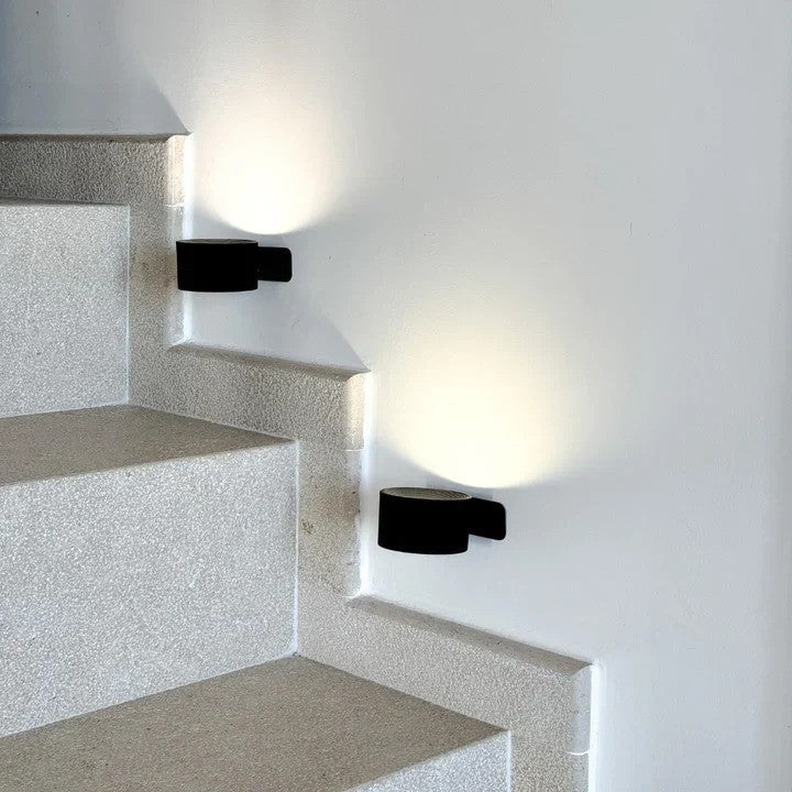 Wireless LumoFlex Lamp, adjustable LED wall light for comfortable living spaces.
