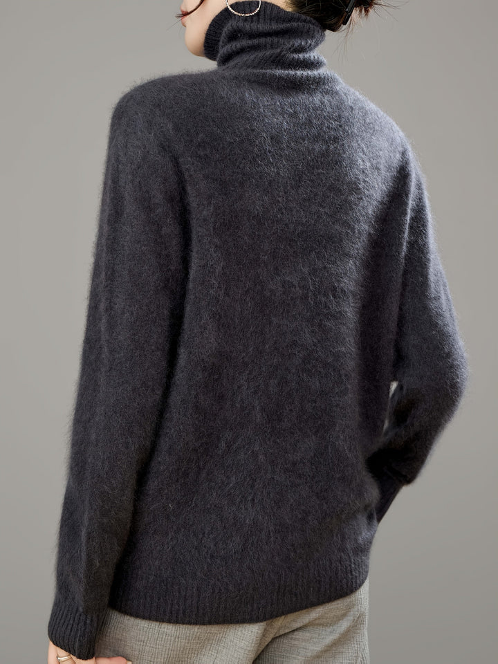 Cozy & warm women's turtleneck sweater. Soft knit, relaxed oversized fit for chic winter fashion & everyday comfort.