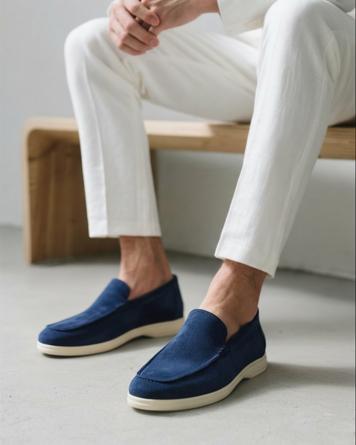 Luxurious black slip-on loafers for men, featuring a comfortable and supportive sole.