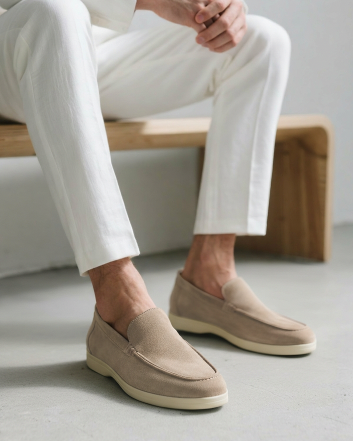 Stylish men's black leather slip-on loafers, perfect for casual or dress occasions.