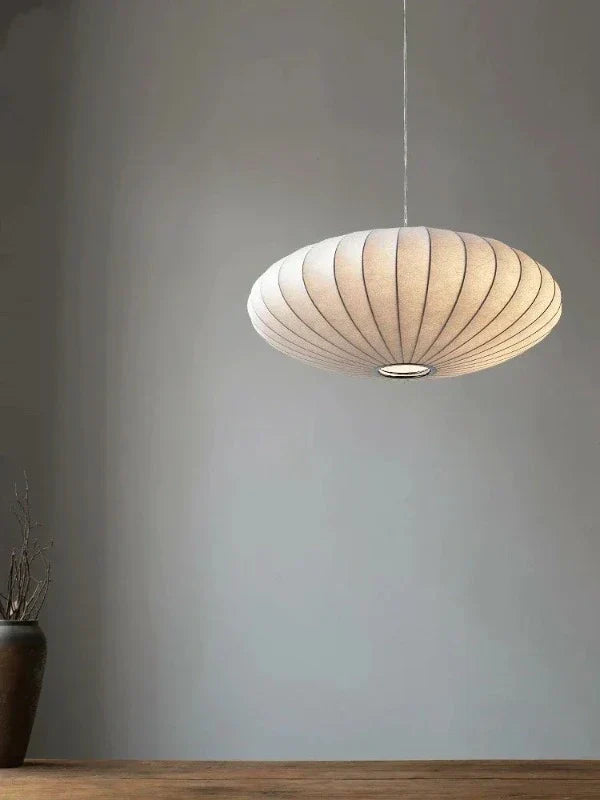 Elegant SilkCrown pendant lamp, combining soft silk and sparkling crystals. Luxury home lighting.