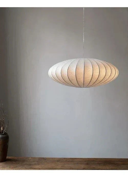 Modern luxury pendant lamp featuring exquisite silk and radiant crystals. Perfect for elegant interiors.