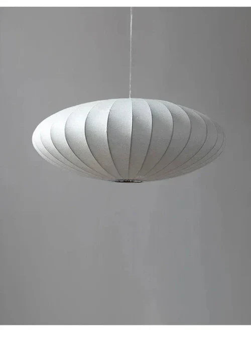 Sophisticated silk pendant lamp adorned with brilliant crystals. Enhances luxury home decor.