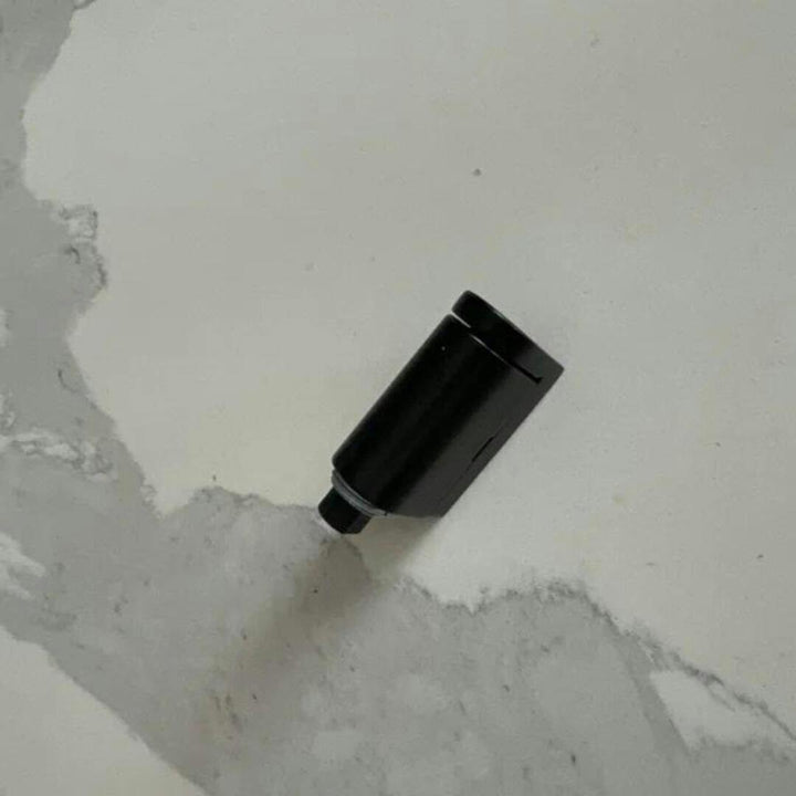 Magnetic door stopper holding a door open. No-drill, self-adhesive bronze door stop for easy use.