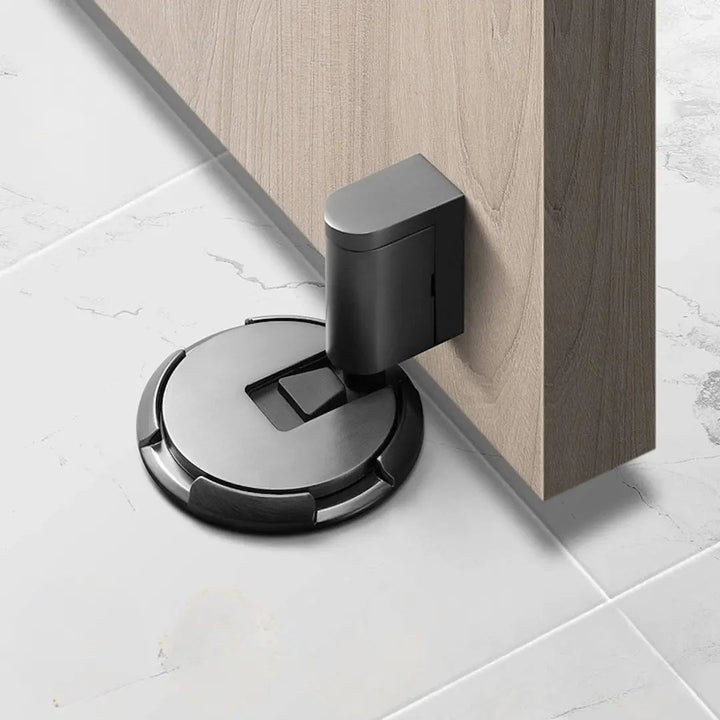 Modern magnetic door stop in bronze. No-drill, self-adhesive solution for wall protection & door holding.