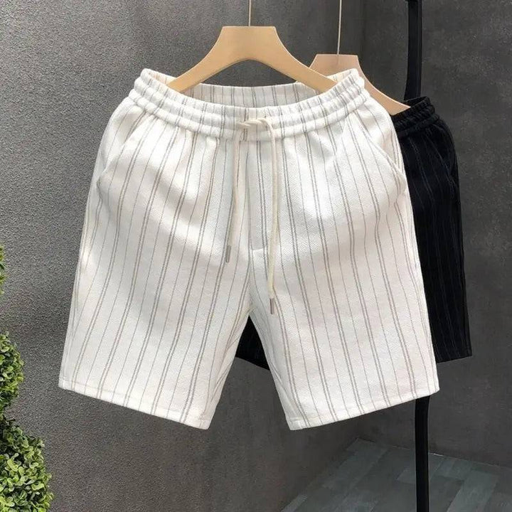 Men's ivory pinstripe shorts, relaxed fit with elastic waist and drawstring. Versatile for any occasion.