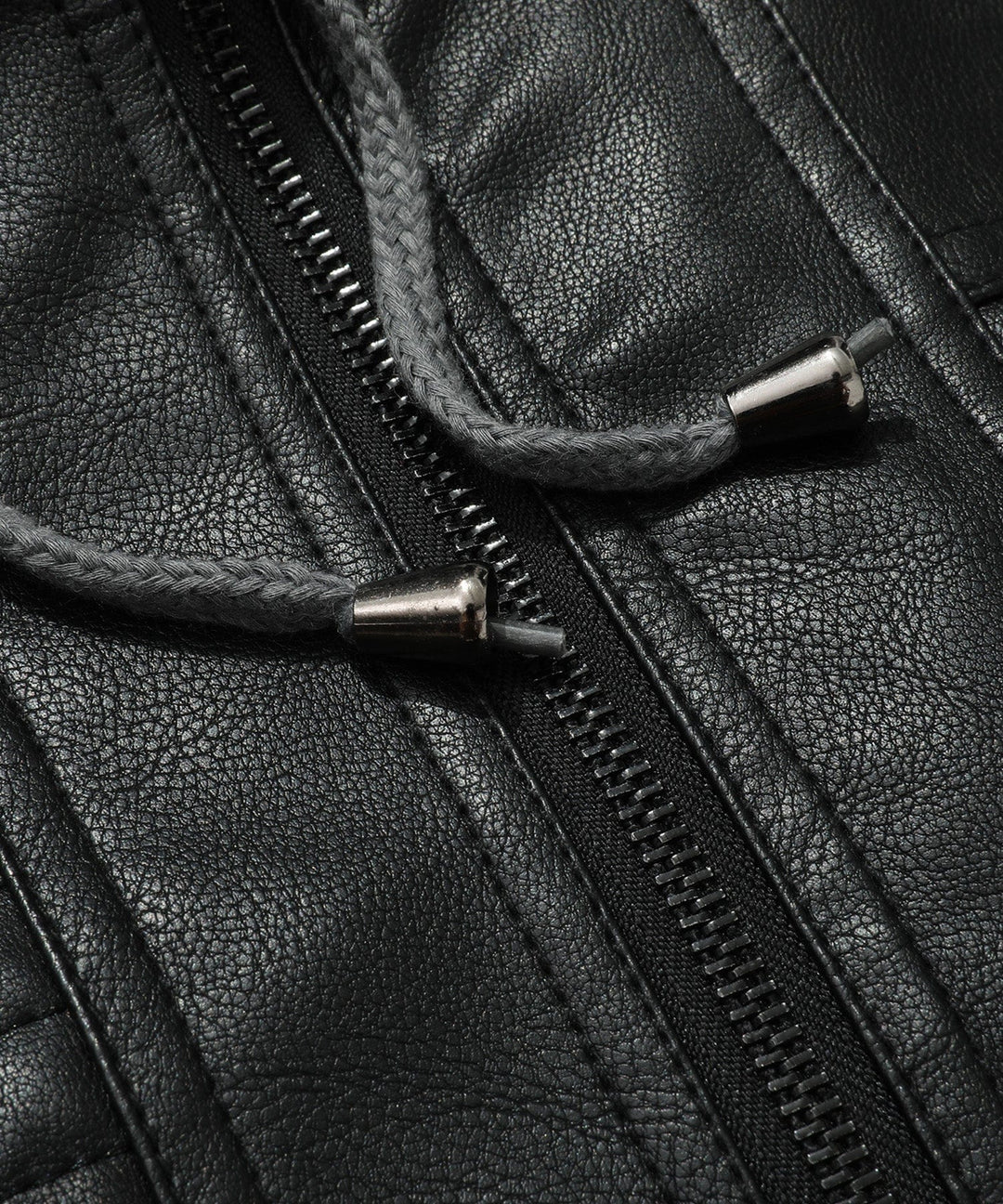 Detailed shot of pocket on men's bomber jacket, black PU leather, and secure zipper, casual style.