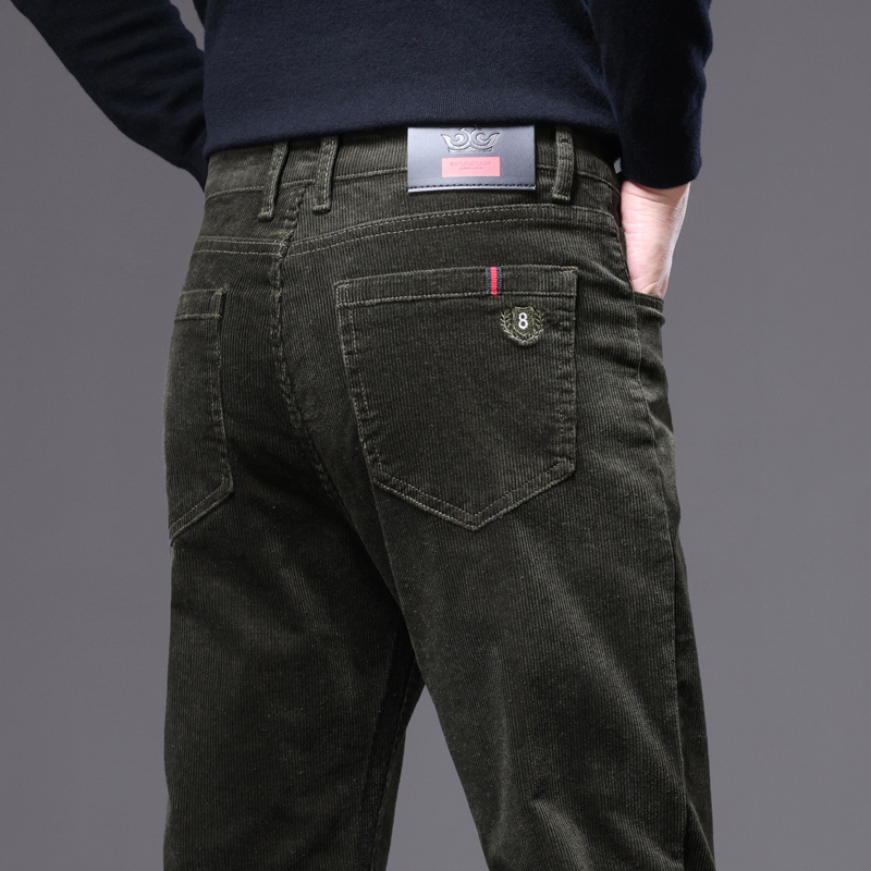 Full-length shot of black corduroy tailored trousers for men, versatile for both casual & formal wear.