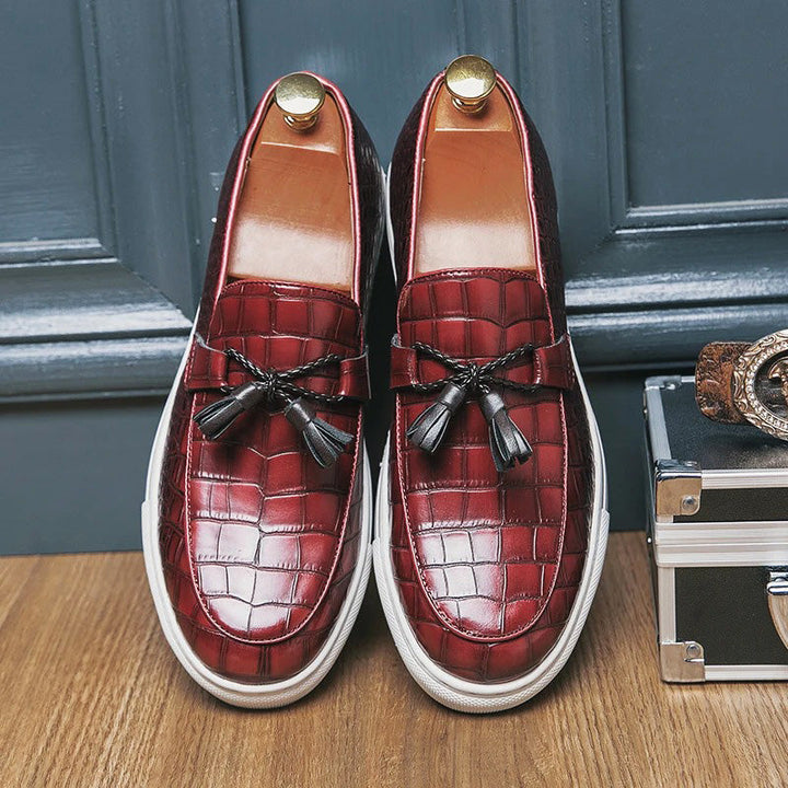 Close-up of men's crocodile print leather tassel loafers, smart casual footwear