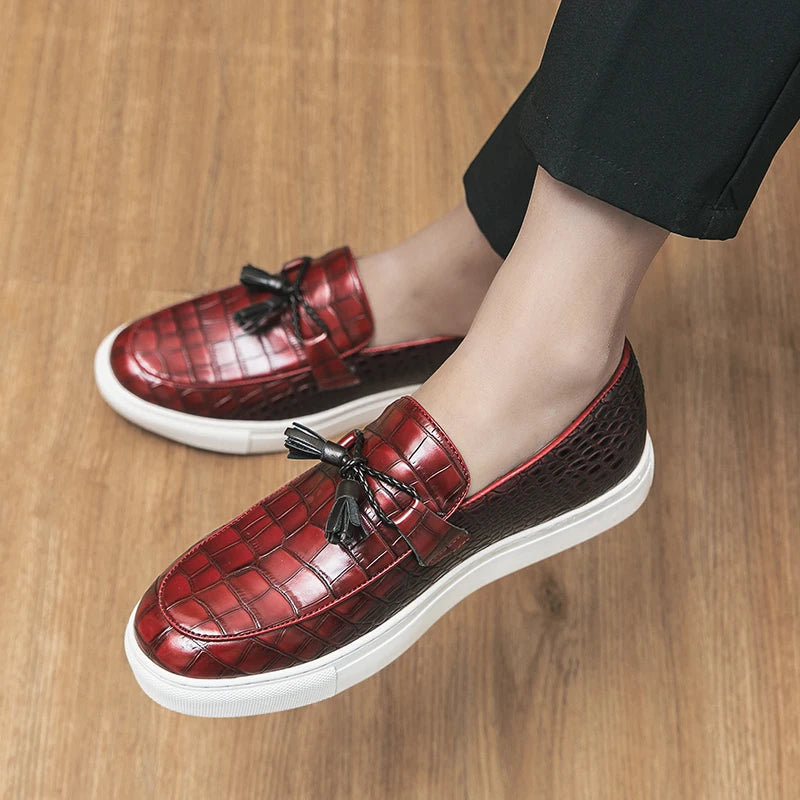 Pair of men's croc embossed leather tassel loafers, perfect for dress or casual wear