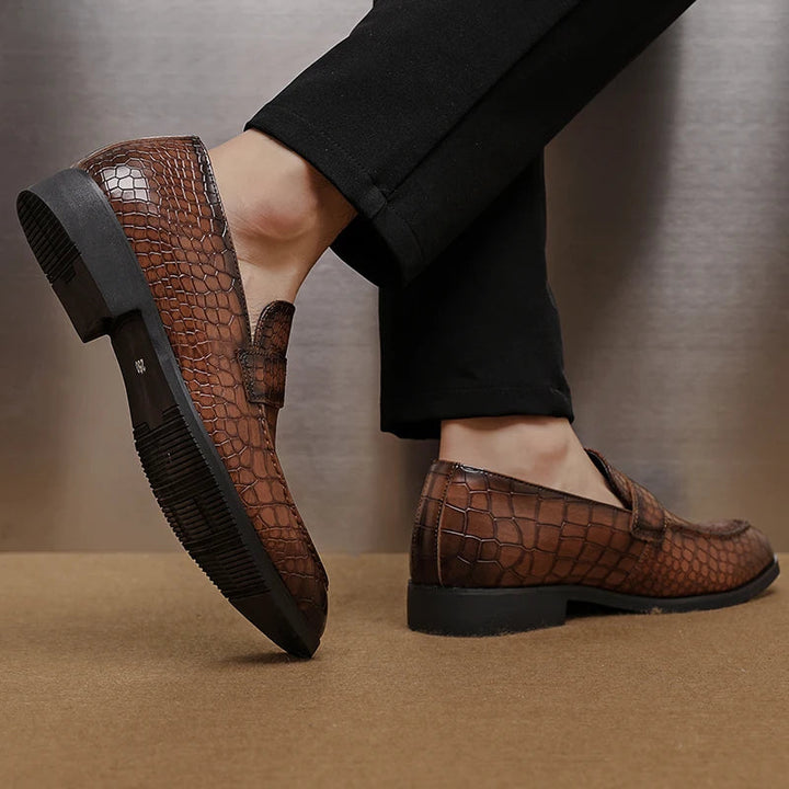 Men's crocodile embossed leather loafers in a dark red hue, elegant formal footwear