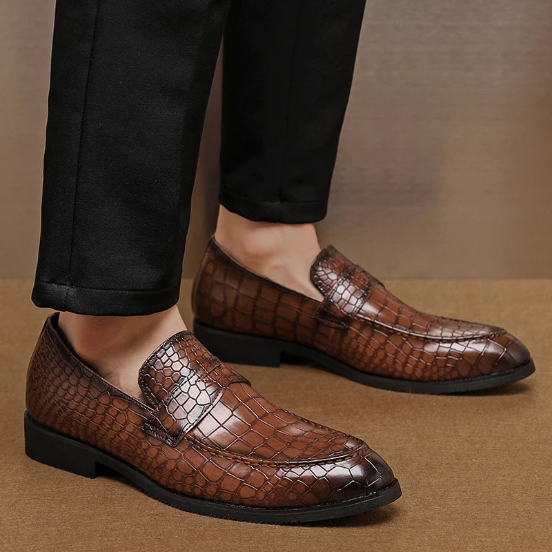 Side view of men's sophisticated crocodile embossed leather loafers, fashionable slip-on shoes