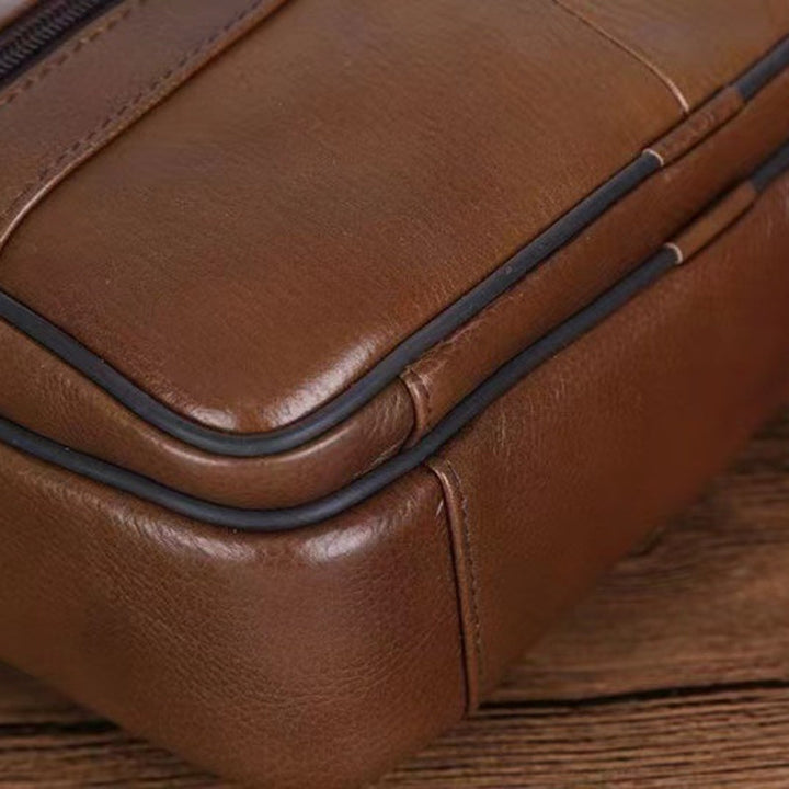 Sleek men's crossbody accessory for daily use; adjustable strap provides comfort & hands-free convenience.