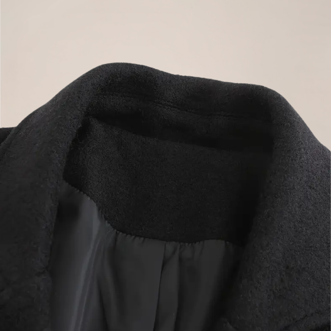 Black double-breasted men's winter overcoat, stylish & tailored, ideal for fall fashion.