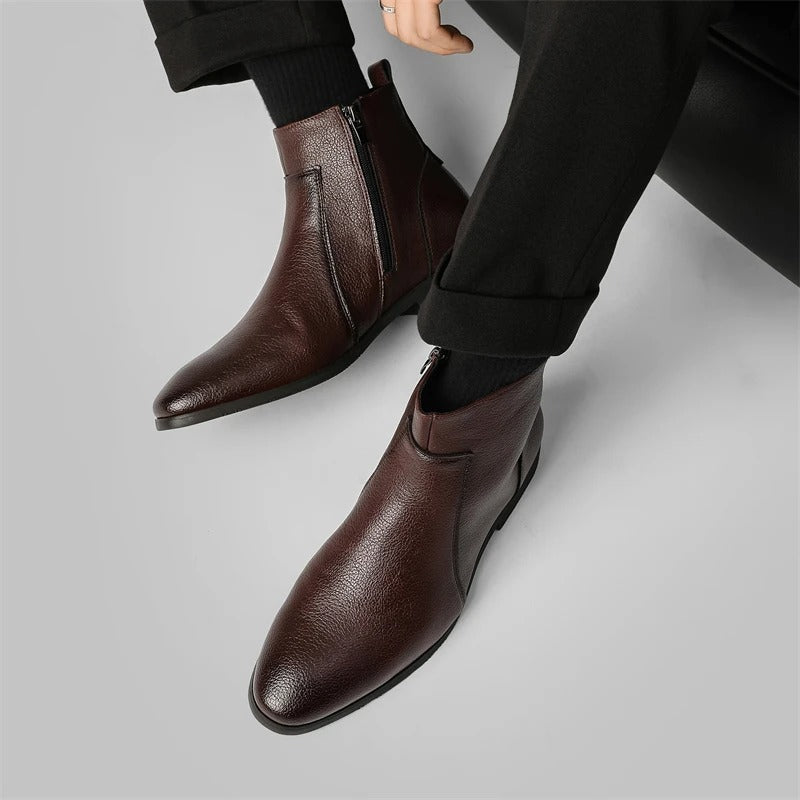 Close-up of men's genuine leather ankle boots with a sleek side zipper and pointed toe design