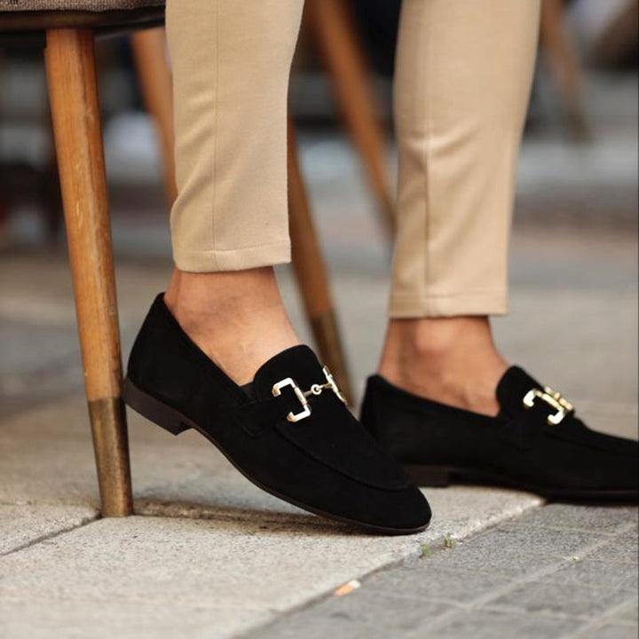 Elegant men's dark brown slip-on horsebit loafers, offering supreme comfort. Versatile for dress shoe occasions or smart casual wear.