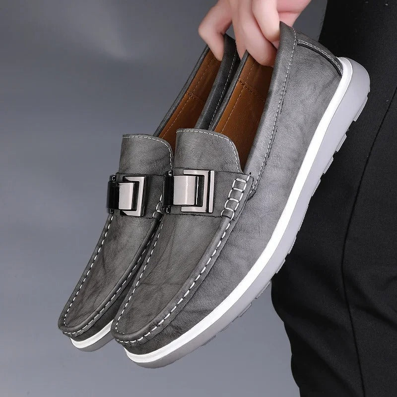 Detail of stitching on a men's casual leather loafer, emphasizing craftsmanship.