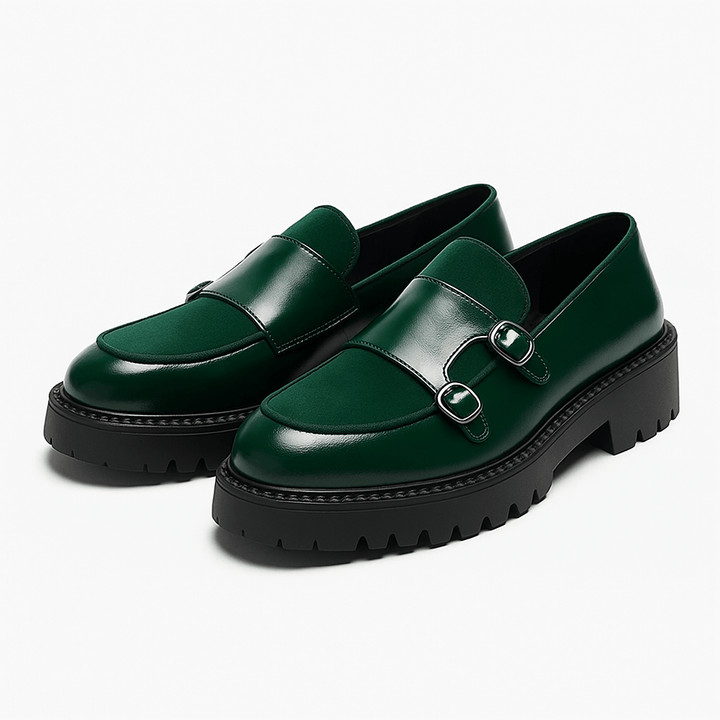 A pair of men's monk strap loafers, showcasing the distinct double buckle closure and smooth finish. Essential formal footwear.