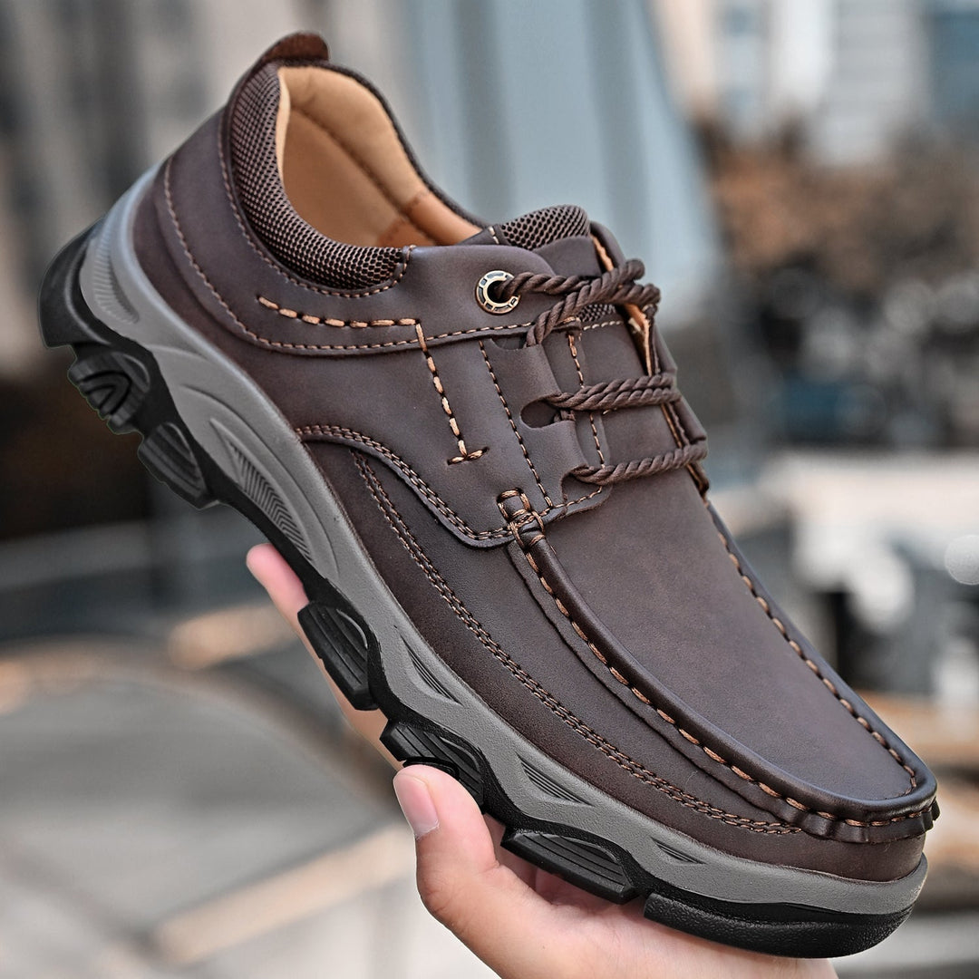 Sole view of men's orthopedic loafers, highlighting advanced slip-resistant technology and arch support