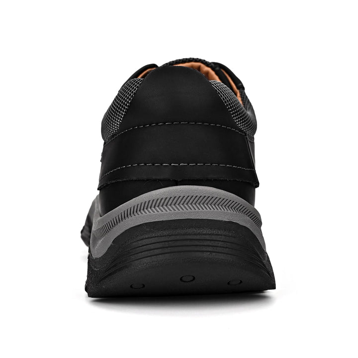 Men's black orthopedic loafers, standing on a white background to emphasize design and support