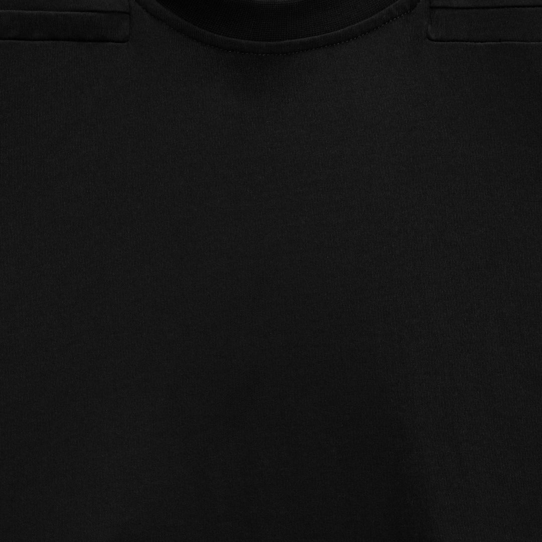 Man wearing a navy blue padded shoulder muscle tee, showcasing an athletic fit.