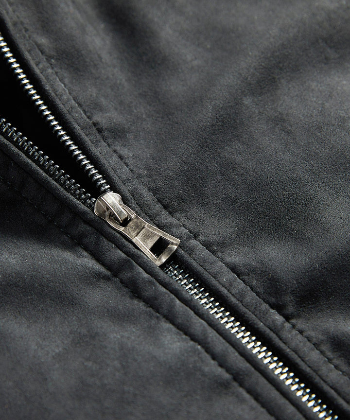 Side profile of a men's black quilted jacket, showcasing the trendy sherpa collar and bomber style.