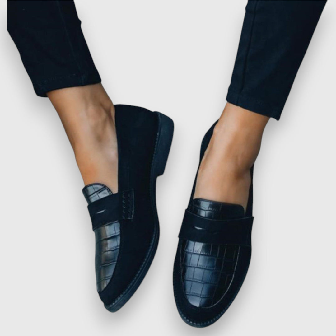 Men's black slip-on loafers with ergonomic comfort fit, ideal for business casual & everyday wear.