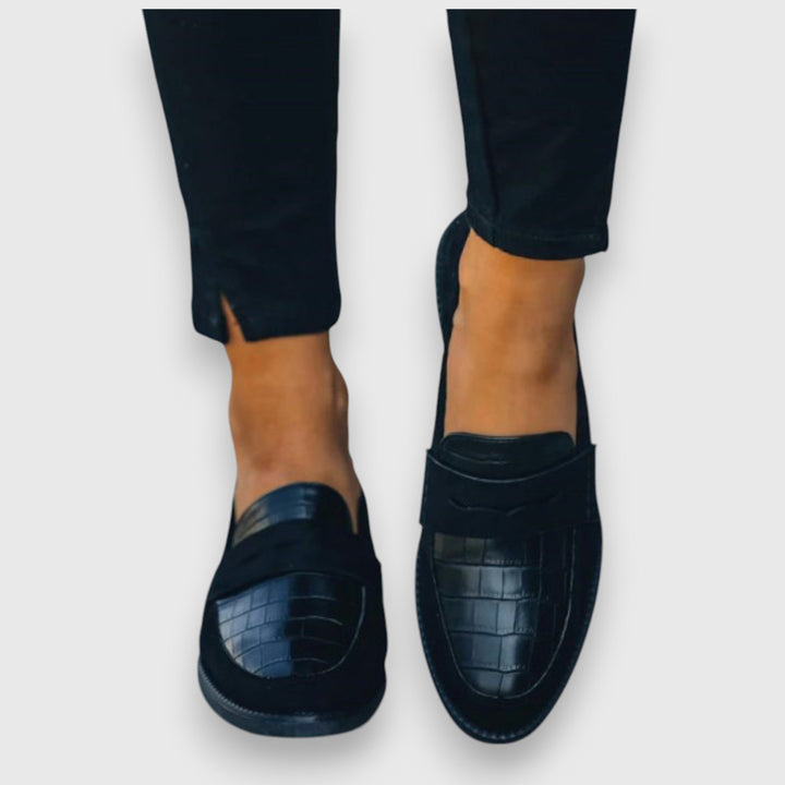 Comfortable men's slip-on loafers with foot support, versatile for casual, business casual, or dress.
