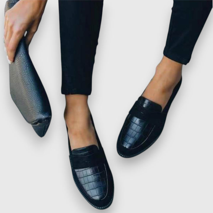 Easy slip-on black men's loafers for ergonomic comfort and excellent foot support. Great for daily wear.