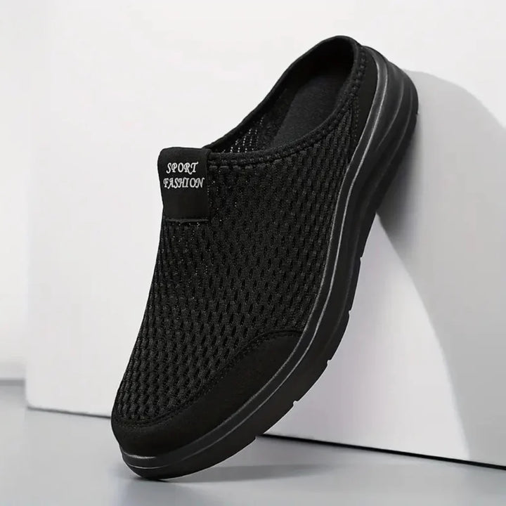 Men's black slip-on orthopedic sandals with arch support for all-day comfort, ideal for casual summer wear.