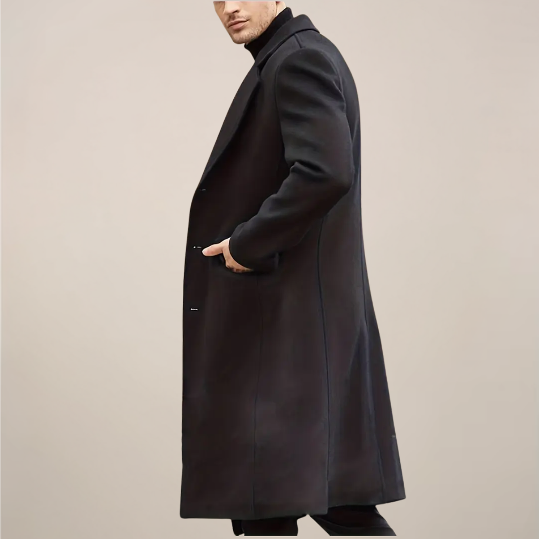Tailored men's black winter coat. Long, single-breasted design for a sophisticated gentleman.