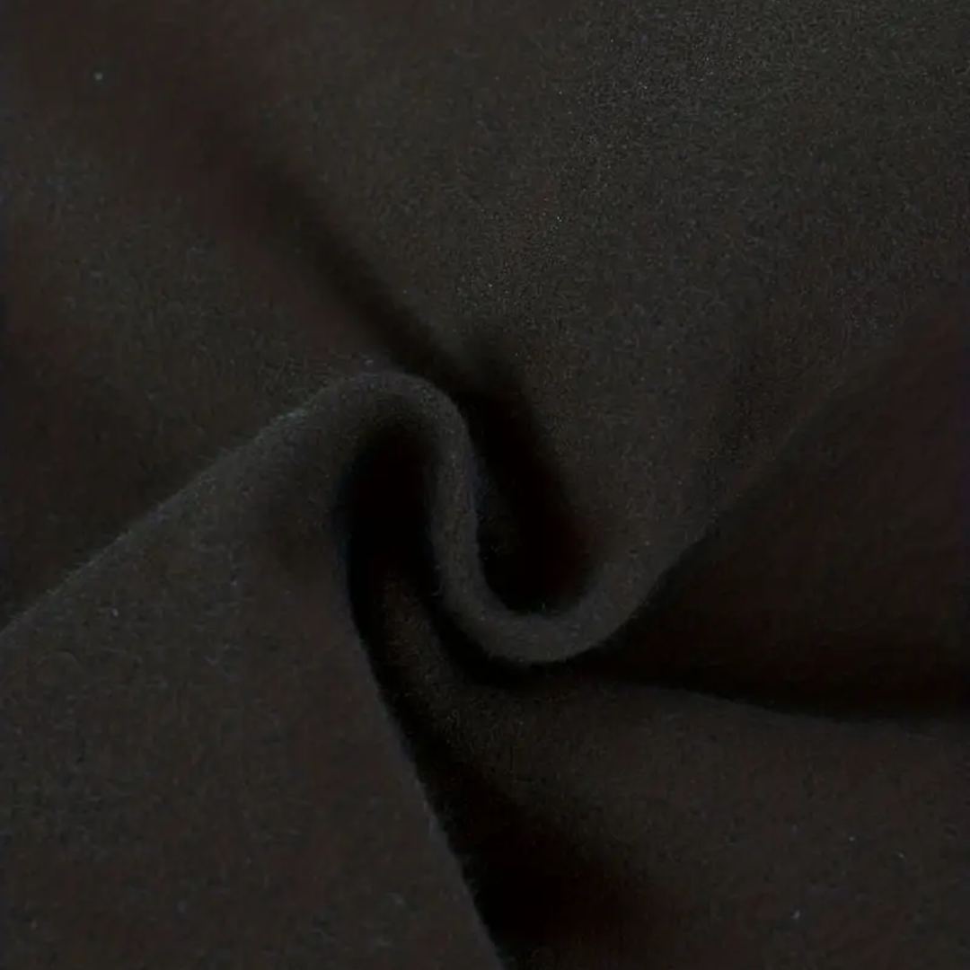 Gentleman's black trench coat, a stylish tailored long overcoat for sophisticated winter fashion.