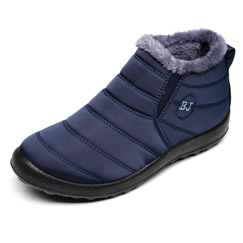 A pair of men's grey insulated snow boots, designed for extreme cold, featuring a waterproof exterior and robust rubber sole.