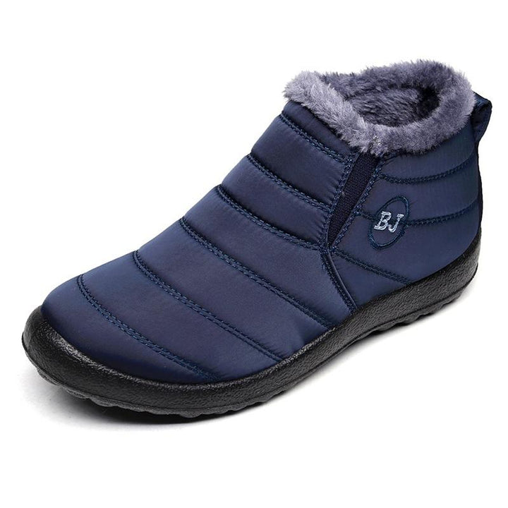 A pair of men's grey insulated snow boots, designed for extreme cold, featuring a waterproof exterior and robust rubber sole.