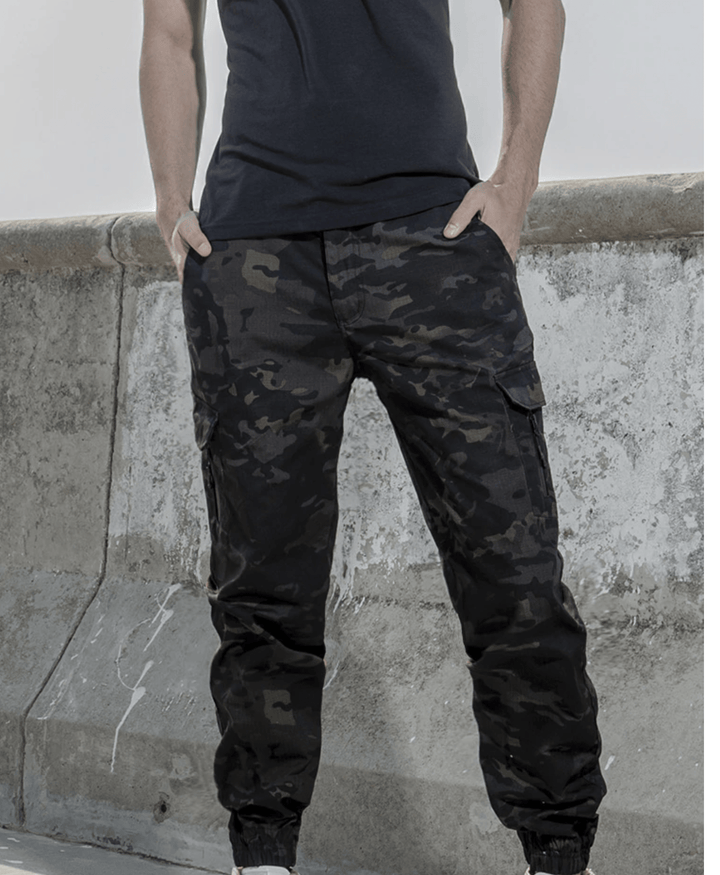Men's casual waterproof jogger pants paired with a t-shirt, showcasing a relaxed outdoor look